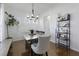 Bright dining room features wood floors, modern chandelier, and stylish decor at 218 Mayfield Dr, Goose Creek, SC 29445