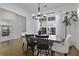 Bright and open dining room with wood floors, chandelier, and stylish table setting at 218 Mayfield Dr, Goose Creek, SC 29445