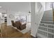 Bright entryway featuring hardwood floors, a staircase, and seamless flow into the kitchen and living room at 218 Mayfield Dr, Goose Creek, SC 29445