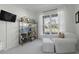 Tranquil home office with comfortable seating, bright window view, and stylish bookshelf at 218 Mayfield Dr, Goose Creek, SC 29445