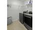 Practical laundry room equipped with modern washer, dryer, and ample storage shelving at 218 Mayfield Dr, Goose Creek, SC 29445
