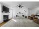 Spacious living room with a fireplace, plush seating, and an open floor plan at 218 Mayfield Dr, Goose Creek, SC 29445