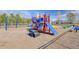 Colorful playground with swings, slides, and climbing structures on a wood chip surface at 218 Mayfield Dr, Goose Creek, SC 29445