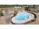 Aerial view of a community pool with lounge chairs and umbrellas, perfect for relaxation and recreation at 218 Mayfield Dr, Goose Creek, SC 29445