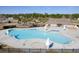 Aerial shot of a community pool with lounge chairs and umbrellas, offering a resort-style experience at 218 Mayfield Dr, Goose Creek, SC 29445