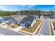 Desirable community featuring craftsman-style homes, lush landscaping, and a tranquil lake, perfect for serene living at 224 Fiddleback Dr, Summerville, SC 29486