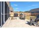 Backyard patio with grill and chairs features a wooden privacy fence at 224 Fiddleback Dr, Summerville, SC 29486