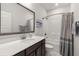 Bright bathroom with a large framed mirror and a shower-tub combination with curtain at 224 Fiddleback Dr, Summerville, SC 29486