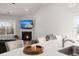 Open floor plan with kitchen island, view of the fireplace, and a sitting area at 224 Fiddleback Dr, Summerville, SC 29486