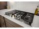 Close up of a stainless steel gas cooktop on a white countertop at 224 Fiddleback Dr, Summerville, SC 29486