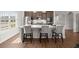 Modern kitchen featuring a large island with seating, stainless steel appliances, and sleek cabinetry with natural light at 224 Fiddleback Dr, Summerville, SC 29486