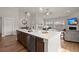 Open kitchen with a large island that includes seating and a stainless steel dishwasher at 224 Fiddleback Dr, Summerville, SC 29486