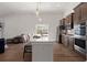 Bright open kitchen with stainless steel appliances, large island, and pendant lighting at 224 Fiddleback Dr, Summerville, SC 29486