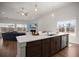 Open concept kitchen with granite countertops, stainless steel appliances, and lots of natural light at 224 Fiddleback Dr, Summerville, SC 29486