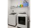 Functional laundry room featuring modern, full-size washer and dryer units at 224 Fiddleback Dr, Summerville, SC 29486
