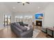 Spacious living room featuring a fireplace, large windows, and comfortable seating at 224 Fiddleback Dr, Summerville, SC 29486