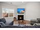 Inviting living room with a cozy fireplace and natural light at 224 Fiddleback Dr, Summerville, SC 29486