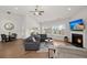Bright living room with wood floors, fireplace, large windows, and access to outdoor patio at 224 Fiddleback Dr, Summerville, SC 29486