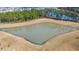 Aerial view of a large pond, surrounded by new homes at 224 Fiddleback Dr, Summerville, SC 29486