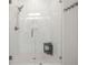 Modern shower with floor to ceiling tile and frameless glass doors at 224 Fiddleback Dr, Summerville, SC 29486