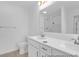 Bright bathroom featuring a double sink vanity, large mirror, and a glass-enclosed shower at 224 Night Heron St # 629, Summerville, SC 29486