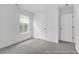 Bright bedroom featuring neutral carpet, a window with blinds, and a closet at 224 Night Heron St # 629, Summerville, SC 29486
