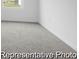 An empty room with grey carpet and white walls and trim at 224 Night Heron St # 629, Summerville, SC 29486