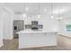 Modern kitchen featuring stainless steel appliances, white cabinets, and a center island with pendant lighting at 224 Night Heron St # 629, Summerville, SC 29486