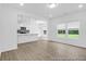 Spacious living area showcasing wood floors, open to the modern kitchen with a breakfast bar at 224 Night Heron St # 629, Summerville, SC 29486