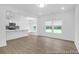 Bright living space featuring wood floors and an open layout connecting to the modern kitchen at 224 Night Heron St # 629, Summerville, SC 29486