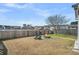 Spacious backyard with a fire pit and partial lake view creating a peaceful and serene atmosphere at 231 Laurel Crest Way, Summerville, SC 29486