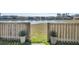 Scenic backyard view with a wooden fence and access to a serene pond in the neighborhood at 231 Laurel Crest Way, Summerville, SC 29486