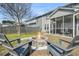 A backyard with a stone fire pit and backyard chairs offering an inviting space for outdoor gatherings at 231 Laurel Crest Way, Summerville, SC 29486