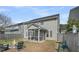 A spacious fenced backyard with a fire pit and screened in porch perfect for entertaining and relaxation at 231 Laurel Crest Way, Summerville, SC 29486