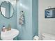 Well-lit half bathroom with a modern vanity, framed mirror, and shiplap accent wall at 231 Laurel Crest Way, Summerville, SC 29486