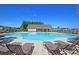 Relaxing community pool with lounge chairs, clubhouse, grill, and playground, offering residents a resort-like experience at 231 Laurel Crest Way, Summerville, SC 29486