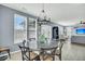 Dining area featuring a round table, modern chandelier, and multiple windows for natural light at 231 Laurel Crest Way, Summerville, SC 29486