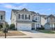Charming two-story home with gray siding, black shutters, a red door, and a two-car garage at 231 Laurel Crest Way, Summerville, SC 29486
