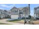 Charming two-story home with gray siding, black shutters, a red door, and a two-car garage at 231 Laurel Crest Way, Summerville, SC 29486
