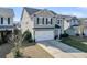 Classic home featuring a two-car garage and manicured landscaping, enhancing curb appeal at 231 Laurel Crest Way, Summerville, SC 29486