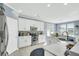 Well-lit kitchen with stainless steel appliances, white cabinetry, and a modern backsplash at 231 Laurel Crest Way, Summerville, SC 29486