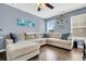 Spacious living area featuring a large sectional sofa, hardwood floors, and abundant natural light at 231 Laurel Crest Way, Summerville, SC 29486