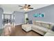 Second-floor living area with hardwood floors, a comfortable sofa, and ample natural light at 231 Laurel Crest Way, Summerville, SC 29486