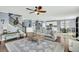 Open-concept living room with a cozy seating area, staircase, and view of the kitchen and dining room at 231 Laurel Crest Way, Summerville, SC 29486