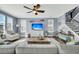 Cozy living room featuring a sofa, chairs, a ceiling fan, and a staircase at 231 Laurel Crest Way, Summerville, SC 29486