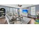 Cozy living room featuring a sofa, chairs, a ceiling fan, and a large rug at 231 Laurel Crest Way, Summerville, SC 29486