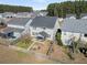 High angle showing a well maintained roof and backyard with manicured lawn at 231 Laurel Crest Way, Summerville, SC 29486