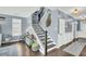View of a staircase with dark wood steps, black railings, and blue walls at 231 Laurel Crest Way, Summerville, SC 29486