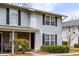 Charming townhome featuring vinyl siding, black shutters, and a cozy front entrance, creating an inviting curb appeal at 2494 Etiwan Ave # 12J, Charleston, SC 29414