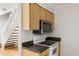 Efficient kitchen featuring white appliances, countertops, wood cabinets, and stylish backsplash at 2494 Etiwan Ave # 12J, Charleston, SC 29414